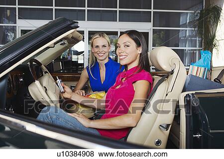 Women Sitting in a Convertible View Large Photo Image Stock Photo - Women Sitting in a Convertible. Fotosearch
