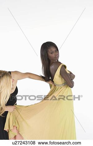 Yellow dress fitting View Large Photo Image Stock Photo - Yellow dress fitting. Fotosearch