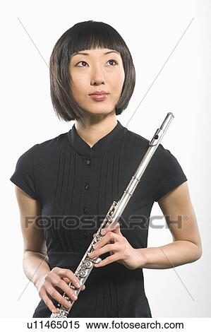 Young Korean woman holds flute View Large Photo Image Stock Photography - Young Korean woman holds flute. Fotosearch