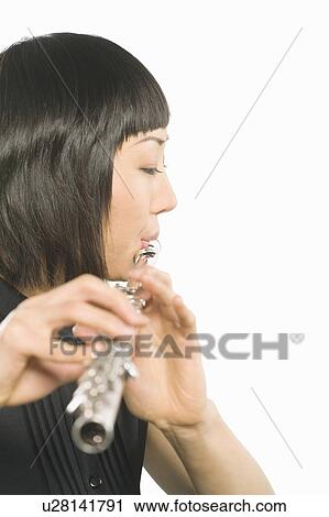 Young Korean woman playing flute View Large Photo Image Stock Image - Young Korean woman playing flute. Fotosearch