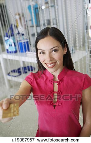 Young Woman Making a Purchase View Large Photo Image Stock Photo - Young Woman Making a Purchase. Fotosearch