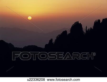 Stock Photo - Morning Sun and Mount Huangshan, Anhui Province, China. Fotosearch