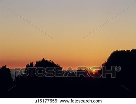 Stock Photograph - Morning Sun and Mount Huangshan, Anhui Province, China. Fotosearch