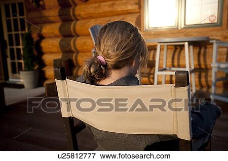 Stock Photo - Back view of a girls head in Gimli, Manitoba, Canada. Fotosearch