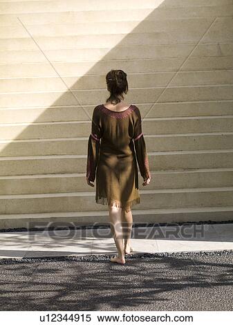 Back view of a woman walking stairs in Bali View Large Photo Image Stock Photography - Back view of a woman walking stairs in Bali. Fotosearch