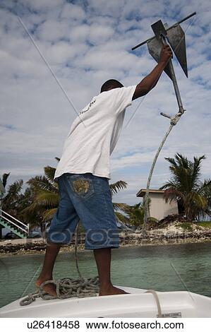 Belize Barrier Reef, Man on Boat View Large Photo Image Stock Photo - Belize Barrier Reef, Man on Boat. Fotosearch