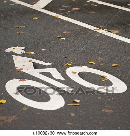 Stock Image - Bicycle path logo in Central Park in Manhattan, New York City, U. S. A.. Fotosearch