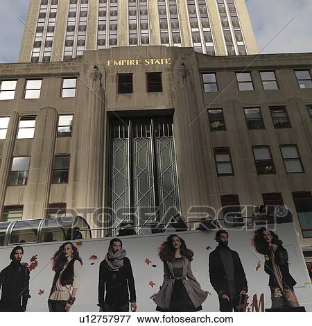 Billboard in front of the Empire State Building, Manhattan, New York City, U. S. A. View Large Photo Image Stock Photo - Billboard in front of the Empire State Building, Manhattan, New York City, U. S. A.. Fotosearch