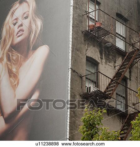 Billboard on the side of a building in Manhattan, New York City, U. S. A. View Large Photo Image Stock Photo - Billboard on the side of a building in Manhattan, New York City, U. S. A.. Fotosearch