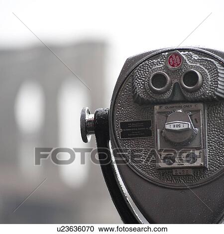 Stock Image - Binoculars on riverbank in Manhattan, New York City, U. S. A.. Fotosearch