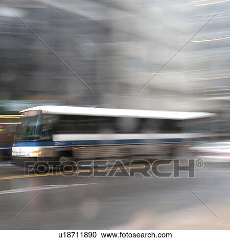 Stock Image - Blurred image of a transit bus in Manhattan, New York City, U. S. A.. Fotosearch