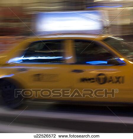 Blurred image of a yellow taxi in Manhattan, New York City, U. S. A. View Large Photo Image Stock Image - Blurred image of a yellow taxi in Manhattan, New York City, U. S. A.. Fotosearch