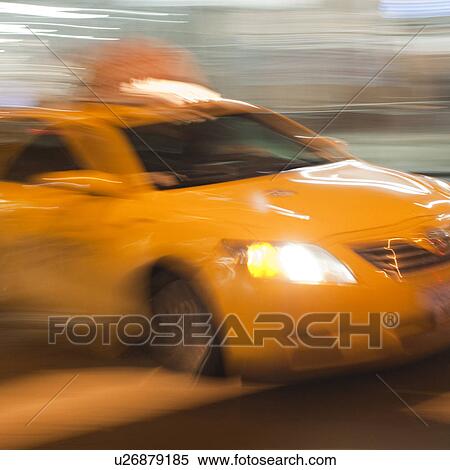 Blurred image of a yellow taxi in Manhattan, New York City, U. S. A. View Large Photo Image Stock Photography - Blurred image of a yellow taxi in Manhattan, New York City, U. S. A.. Fotosearch