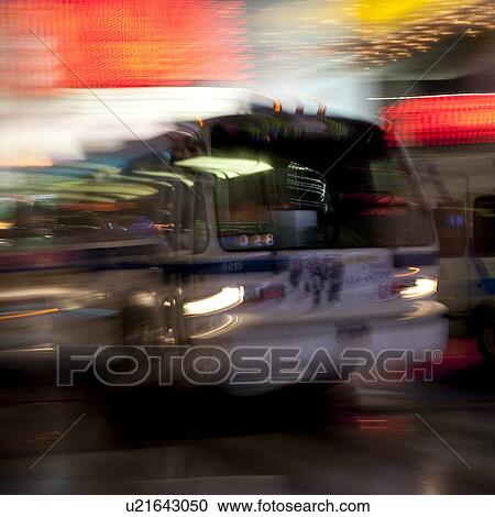 Stock Image - Blurred view of a bus in Manhattan, New York City, U. S. A.. Fotosearch