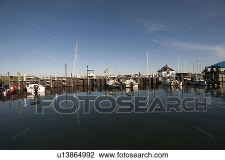 Stock Image - Boats moored at Sag Harbour. Fotosearch