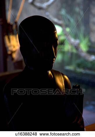 Stock Photo - Buddha statue in Bali. Fotosearch