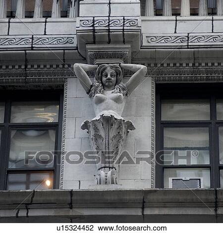 Carvings on the exterior of a building in Manhattan, New York City, U. S. A. View Large Photo Image Stock Image - Carvings on the exterior of a building in Manhattan, New York City, U. S. A.. Fotosearch