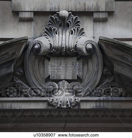 Carvings on the exterior of a building in Manhattan, New York City, U. S. A. View Large Photo Image Stock Photo - Carvings on the exterior of a building in Manhattan, New York City, U. S. A.. Fotosearch