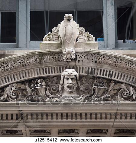 Stock Image - Carvings on the John W McCormack Court House in Boston, Massachusetts, USA. Fotosearch