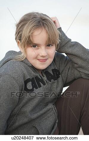 Stock Photo - Caucasian girl looking at the camera in Gimli, Manitoba, Canada. Fotosearch