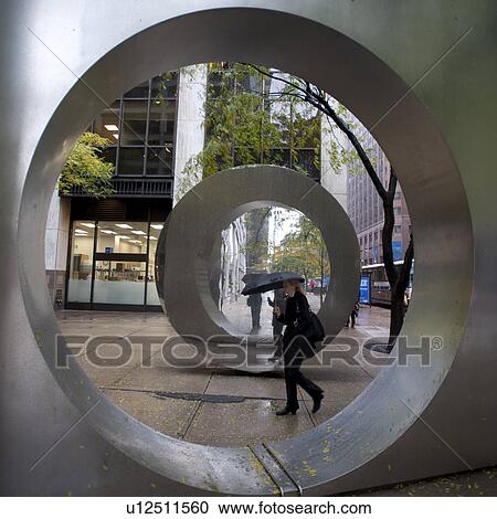 Stock Image - Circular sculpture in Manhattan, New York City, U. S. A.. Fotosearch