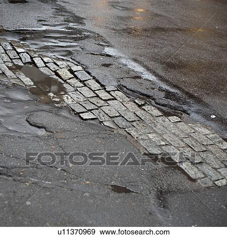 Cobblestone and pavement in Manhattan, New York City, U. S. A. View Large Photo Image Stock Photo - Cobblestone and pavement in Manhattan, New York City, U. S. A.. Fotosearch