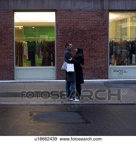 Couple embracing on the streets of Manhattan, New York City, U. S. A. View Large Photo Image Stock Photo - Couple embracing on the streets of Manhattan, New York City, U. S. A.. Fotosearch