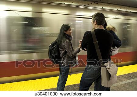 Stock Image - Couple in the subway, Boston, Massachusetts, USA. Fotosearch