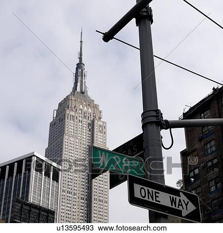 Empire State Building and street signs in Manhattan, New York City, U. S. A. View Large Photo Image Stock Image - Empire State Building and street signs in Manhattan, New York City, U. S. A.. Fotosearch