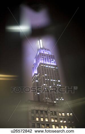 Stock Image - Empire State Building at night in Manhattan, New York City, U. S. A.. Fotosearch