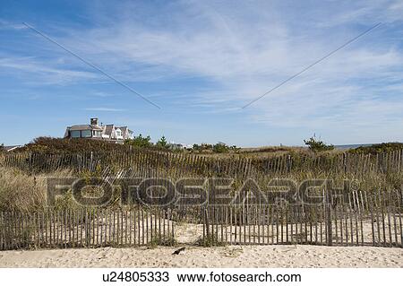 Stock Image - Fencing along the beach in the Hamptons. Fotosearch