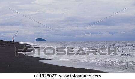 Stock Photo - Fishesrman on beach in Bali. Fotosearch