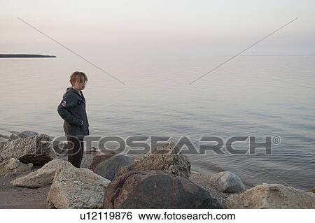 Girl along the shoreline in Gimli, Manitoba, Canada View Large Photo Image Stock Photograph - Girl along the shoreline in Gimli, Manitoba, Canada. Fotosearch
