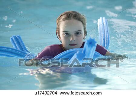 Picture - Girl in a swimming pool at Gimli, Manitoba, Canada. Fotosearch