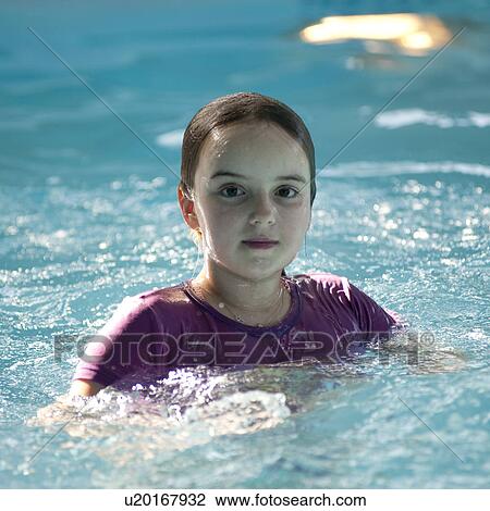 Stock Image - Girl in a swimming pool at Gimli, Manitoba, Canada. Fotosearch