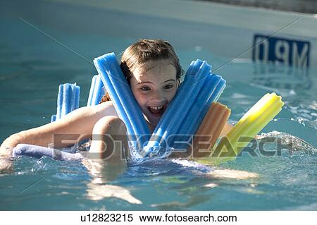Stock Photography - Girl in a swimming pool at Gimli, Manitoba, Canada. Fotosearch