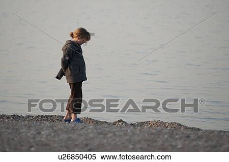 Girl standing on the beach at Gimli, Manitoba, Canada View Large Photo Image Stock Photography - Girl standing on the beach at Gimli, Manitoba, Canada. Fotosearch