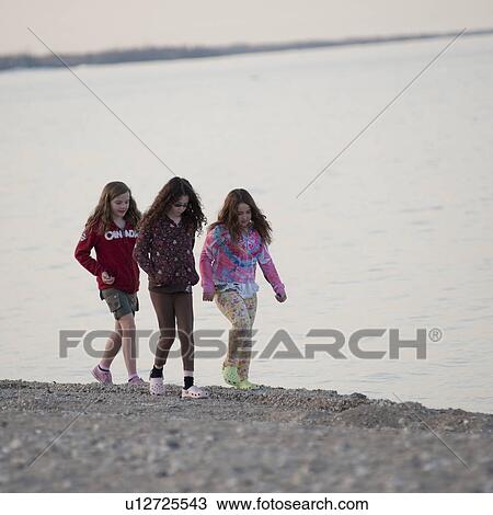Girls walking along the beach at Gimli, Manitoba, Canada View Large Photo Image Stock Image - Girls walking along the beach at Gimli, Manitoba, Canada. Fotosearch