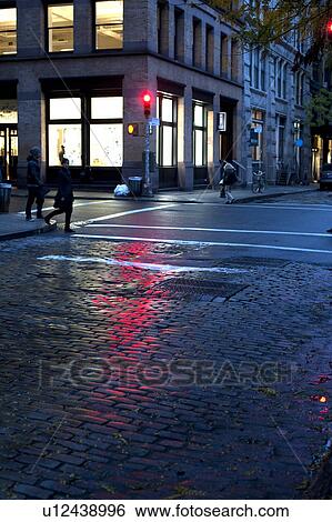 Stock Photograph - Intersection at night in Manhattan, New York City, U. S. A.. Fotosearch