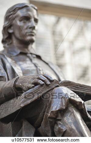 Stock Image - John Harvard statue at Harvard University in Boston, Massachusetts, USA. Fotosearch