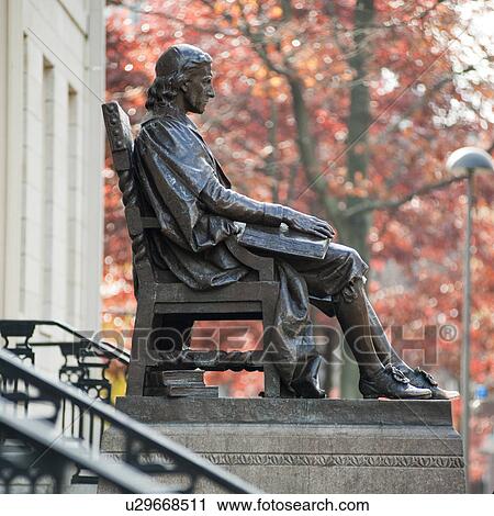 Stock Image - John Harvard statue at Harvard University in Boston, Massachusetts, USA. Fotosearch