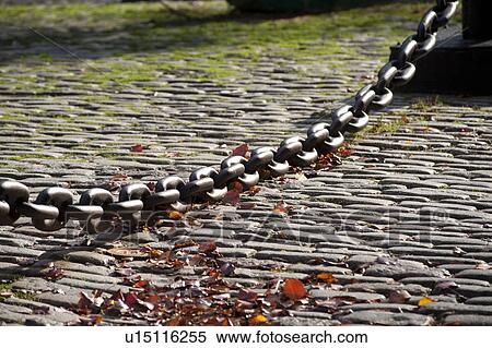 Stock Photography - Large chain across cobblestone walkway in Boston, Massachusetts, USA. Fotosearch
