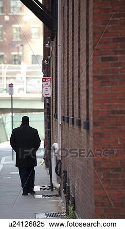 Man on the sidewalk in Boston, Massachusetts, USA View Large Photo Image Stock Photography - Man on the sidewalk in Boston, Massachusetts, USA. Fotosearch