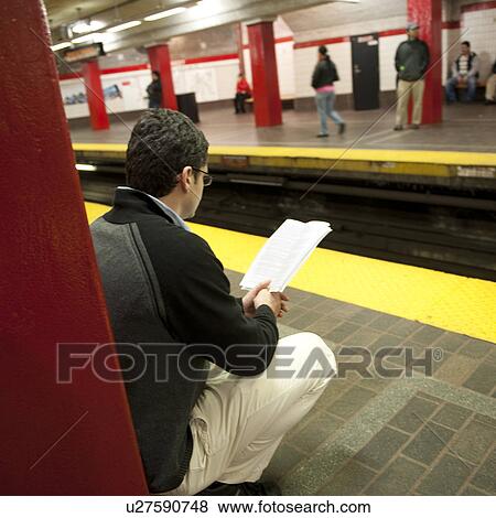 Man reading in the subway in Boston, Massachusetts, USA View Large Photo Image Stock Photo - Man reading in the subway in Boston, Massachusetts, USA. Fotosearch