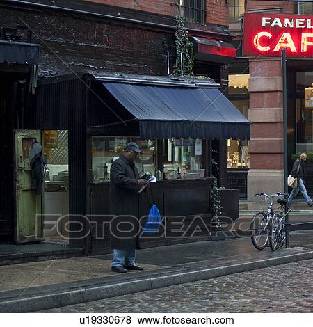 Stock Photo - Man standing on street in Manhattan, New York City, U. S. A.. Fotosearch
