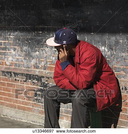 Man talking on a cell phone in Manhattan, New York City, U. S. A. View Large Photo Image Stock Photo - Man talking on a cell phone in Manhattan, New York City, U. S. A.. Fotosearch