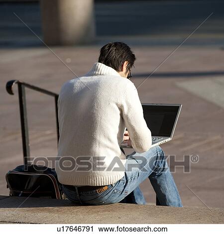 Man with a laptop computer in Boston, Massachusetts, USA View Large Photo Image Stock Image - Man with a laptop computer in Boston, Massachusetts, USA. Fotosearch
