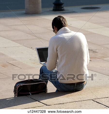 Stock Photo - Man with a laptop computer in Boston, Massachusetts, USA. Fotosearch