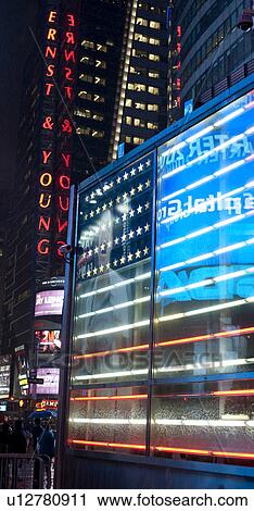 Stock Image - Neon lights in Times Square Manhattan, New York City, U. S. A.. Fotosearch