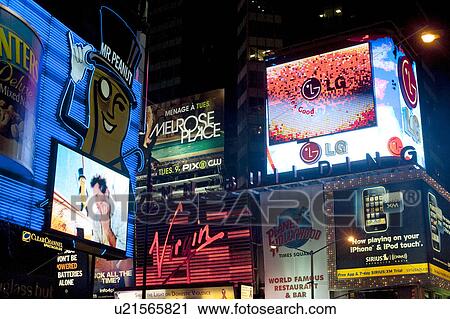Stock Image - Neon signs in Times Square Manhattan, New York City, U. S. A.. Fotosearch